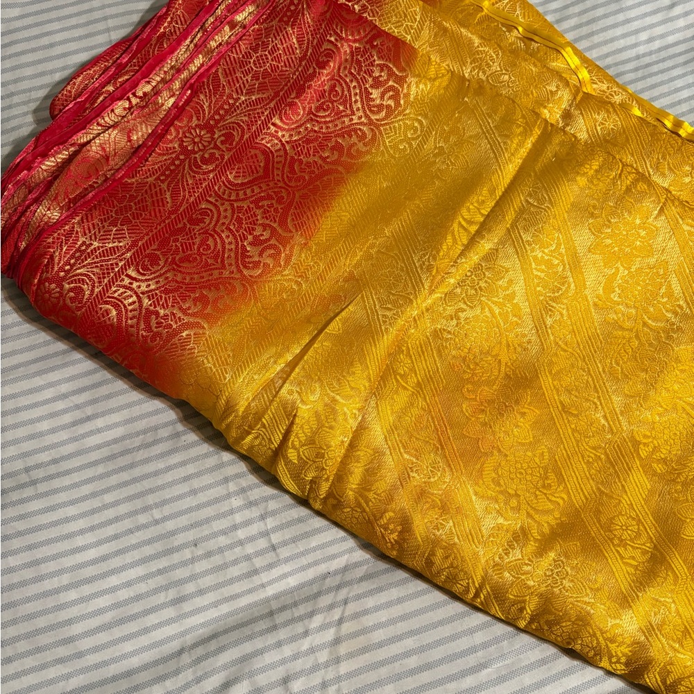 Vibrant Red and Gold Patterned Saree